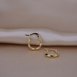 The Demure hoops are staple earrings that make perfect gifts for her