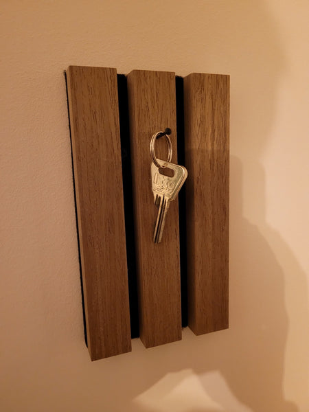 Sleutel ophangen houten paneel 1 stukje over