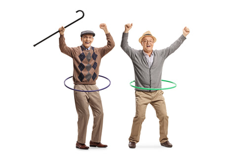 Two old man dancing with hula hoop and hands raised