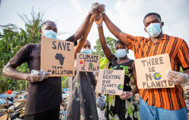 Alt: Climate change protestors in Africa wearing face masks and gloves