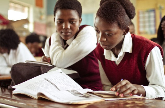 Alt: Two girls wearing school uniform in education in Africa