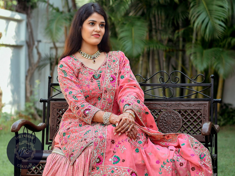 Women wearing hand-embroidered farshi ghararas