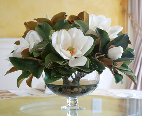 Faux floral arrangement displayed on a glass table 