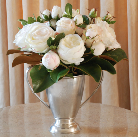 High-end faux floral arrangement in a pewter trophy
