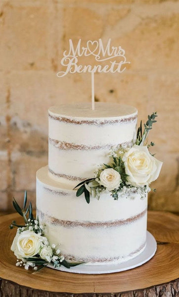 semi naked wedding cake with topper