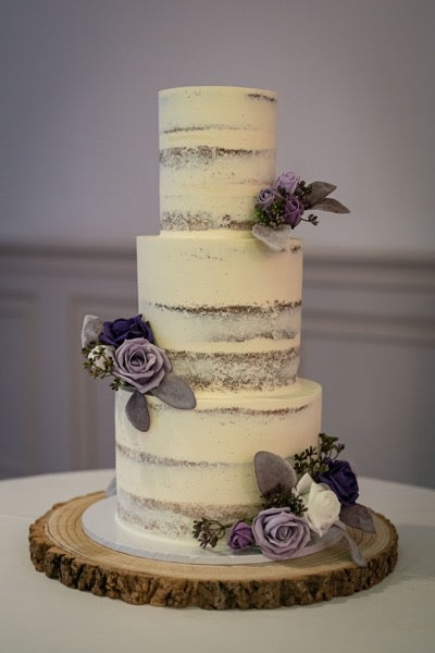 Faux flowers on semi naked wedding cake at Manor by the Lake