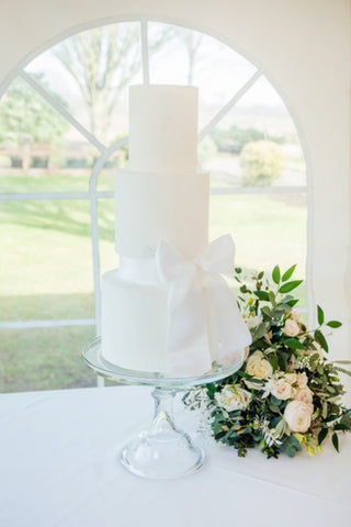 White three tiered wedding cake at Vanilla Pod Bakery