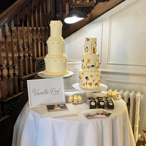 wedding fair display - 2 cakes and some tasters - vanilla pod bakery at Slaughters Manor House hotel