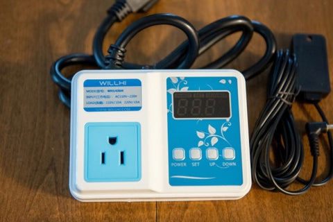 A blue and white humidity controller.