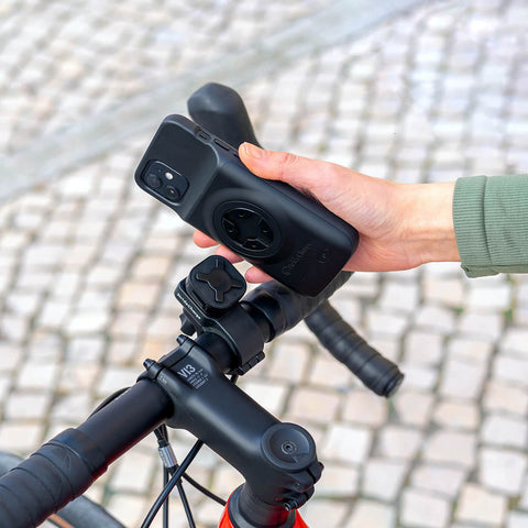 The StrideCharge Charge Case being attached to the Stride Bike Mount. The Bike Mount is attached to a bicycle's handlebars