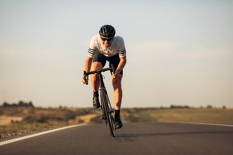 A cyclist training outdoors, focusing on building a strong base of aerobic fitness