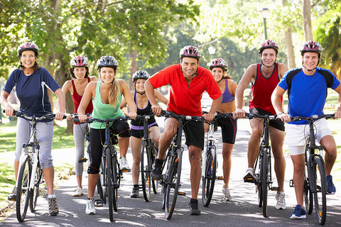 An image of a group of cyclists participating in a cycling workout beginner session, improving their skills and enhancing their cycling experience.