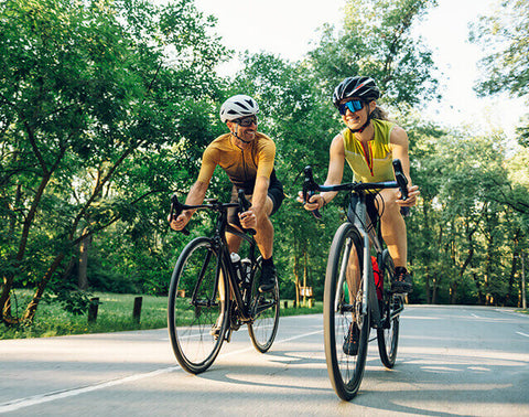 A cyclist riding a bike on a road