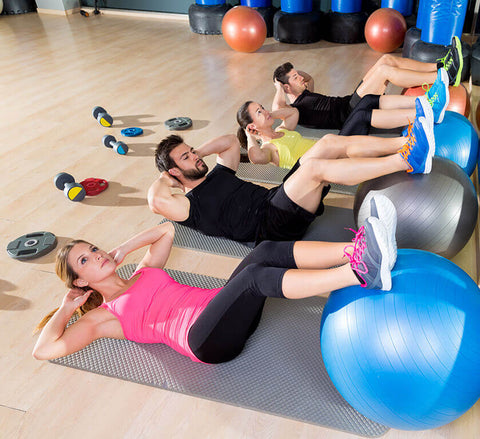 A group of people doing circuit training to combine cardio and strength training