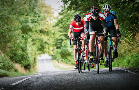 A cyclist riding in a group, enjoying the social aspect of base training