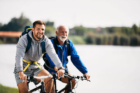 A father and son cycling together to enjoy the health benefits of cycling