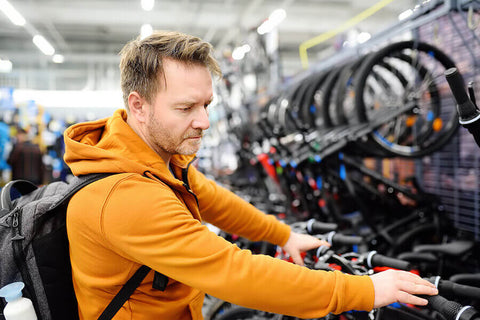 A cyclist choosing a bicycle to purchase