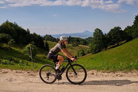 A person riding a gravel bike on a rocky terrain, showcasing the essence of gravel biking