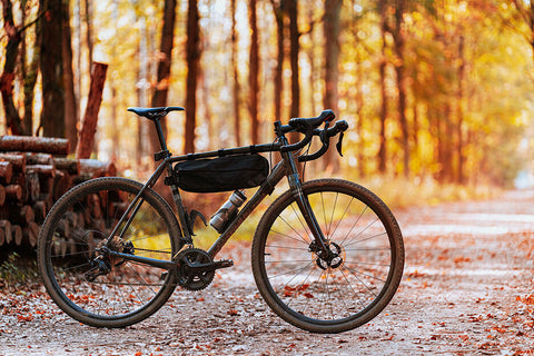 A gravel bike with wider tires and relaxed geometry, ready for a gravel ride