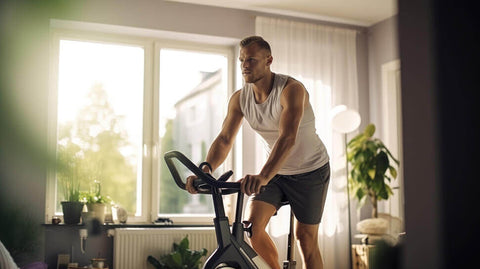 A man riding on an indoor bicycle