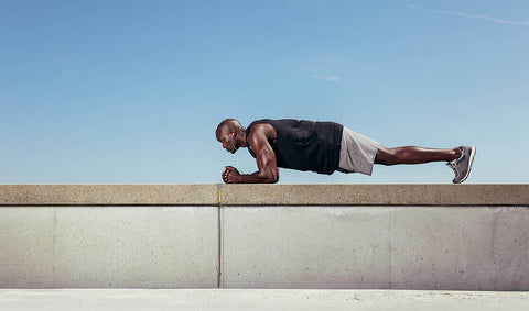 Man doing a plank outside