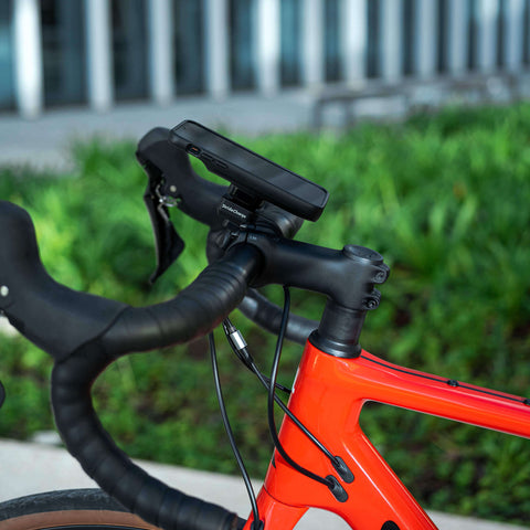 The StrideCharge attached to a bike's handlebars