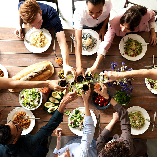 Friends having great time eating food and having fun while playing board games