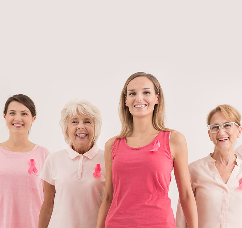 Ladies of all ages wearing pink and smiling
