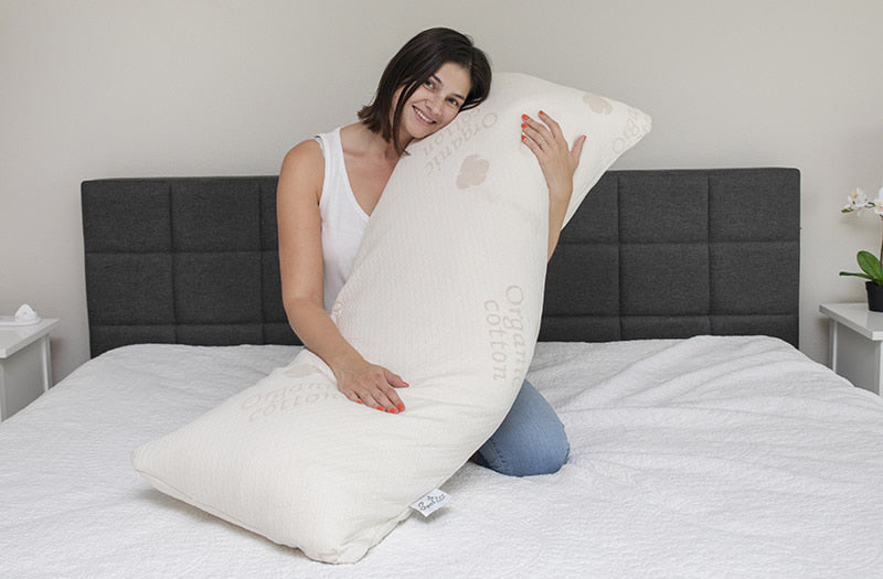 this is a Sweet Zzz body pillow being hug by a pregnent lady