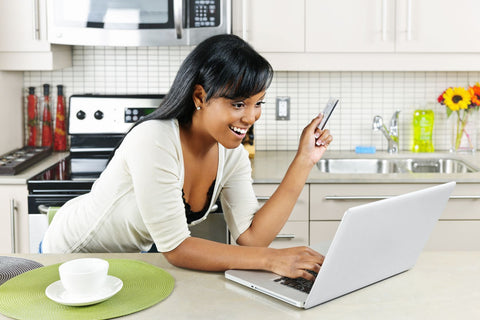 women making payment using laptop
