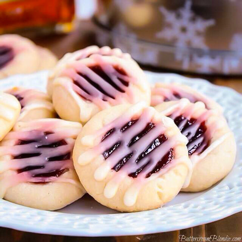 Classic thumbprint cookies get a sweet upgrade with a shortbread cookie base, raspberry filling and Amaretto glaze. 