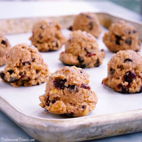 Filled with applesauce, cranberries, dark chocolate and cinnamon whiskey, these cozy apple cranberry oatmeal cookies are a must bake!