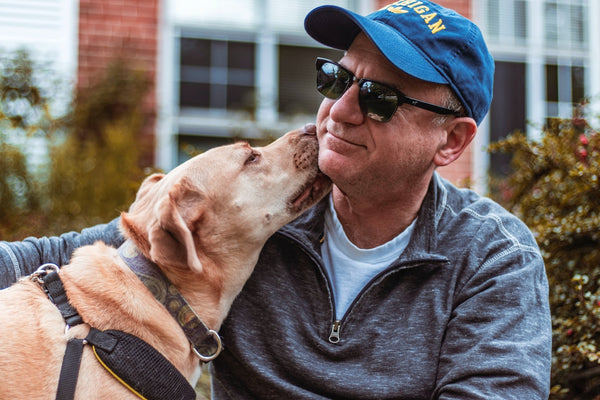 dog loving its owner