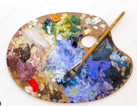 Photo of a paint pallet and paint brush with lots of colors on it