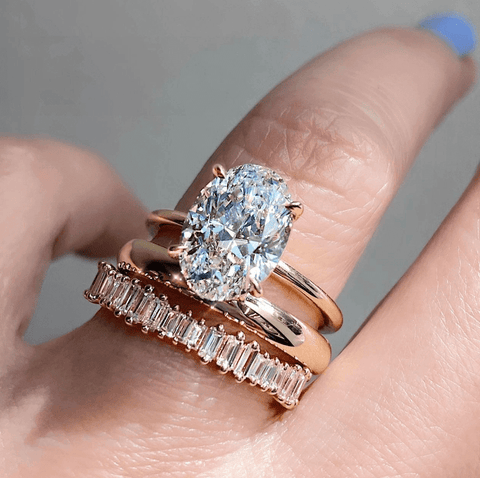 3 different rings stacked together on a finger