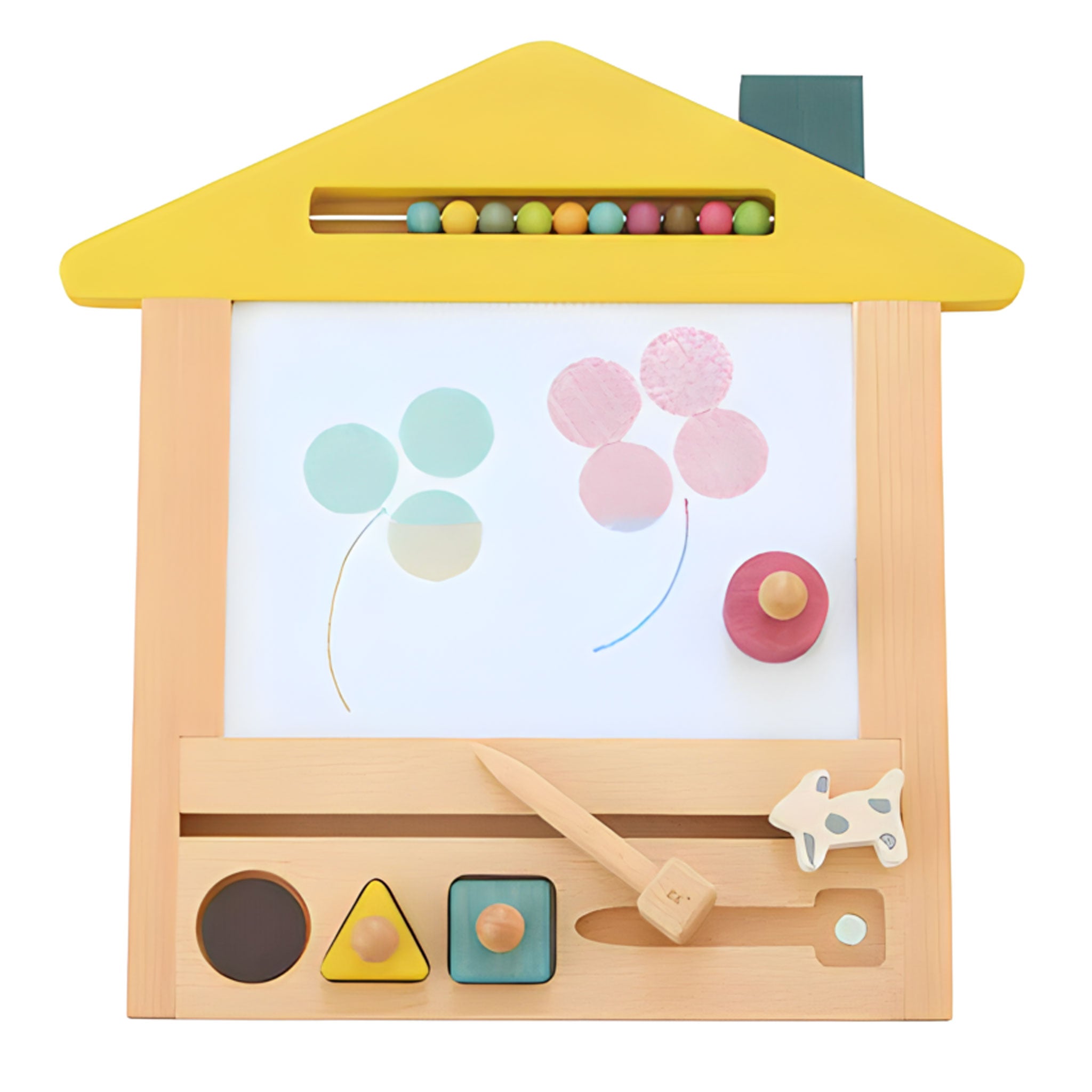 A frontal view of the oekaki board, demonstrating its removable magnetic drawing tools. It's in the shape of a house, with a yellow roof and blue chimney.