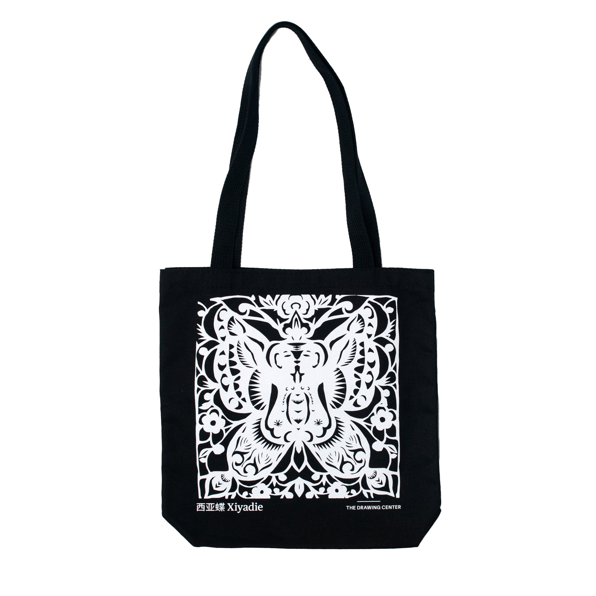 Front of Xiyadie Everyday tote featuring a reproduction of the artwork Butterfly, 2006 by Xiyadie. Printed in white onto black canvas.