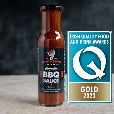 Little Red's Chipotle BBQ Sauce displayed next to its Gold Award from the Irish Quality Food And Drinks Awards.