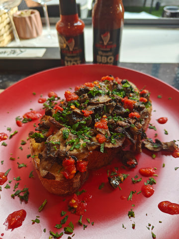 Final plating of Air Fryer Miso Mushrooms on Sourdough Toast, garnished with fresh parsley and drizzled with Little Red's award-winning Everyday Hot Sauce