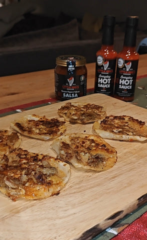 Image of Smashed Gyozas, Spicy Gravy and fermented hot sauce and slow roasted salsa