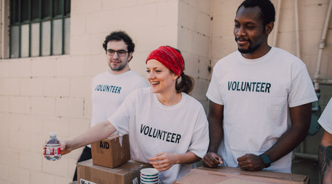 Image of three people volunteering