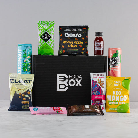 A black box surrounded by colourful foodie packets. Click on the image to visit our shop listing to hear what these products are!