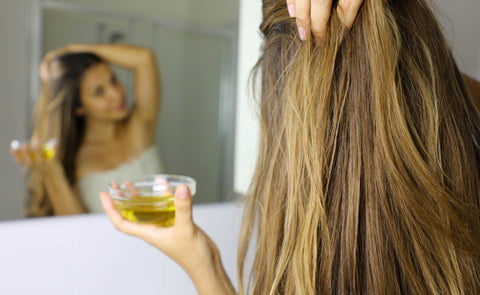 Woman Oiling Hair