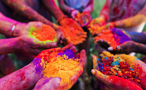 People Holding Holi Colours