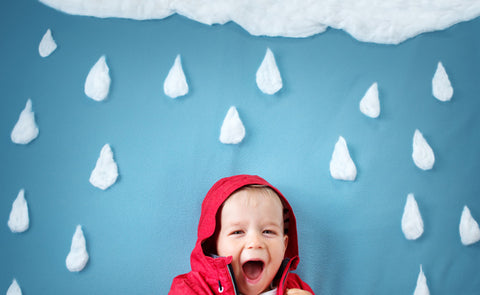 Little Kid Enjoying The Rain