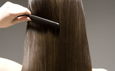 woman combing hair