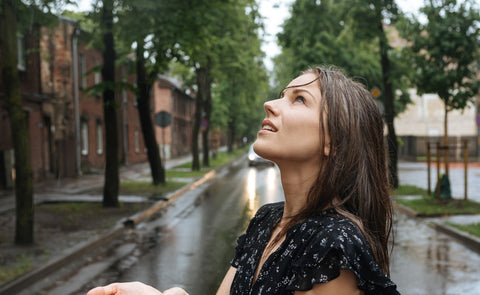  Woman Enjoying The Rain