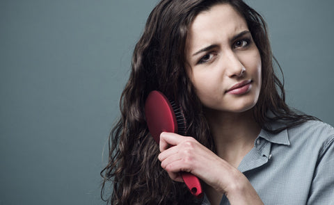 Woman Combing Hair