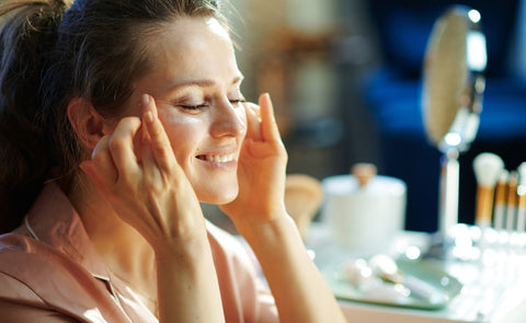 Woman Applying Skincare Products