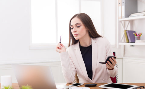 Woman Doing Makeup At Office